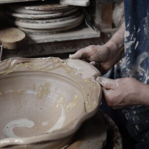 Developing new clay work. Creating handles from a cut rim decorated with a textured bisque roulette